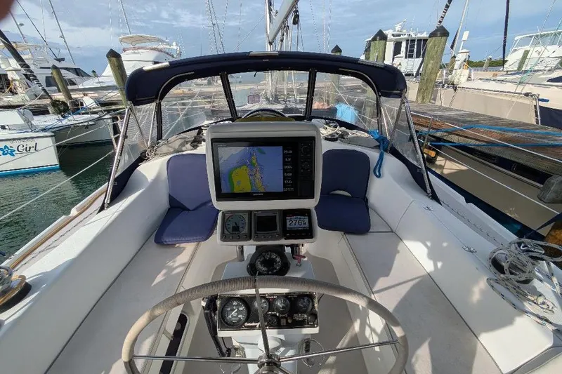 Slide: The Image of Cockpit view of a 2008 Catalina 350 MkII sailboat with navigation equipment. - 22