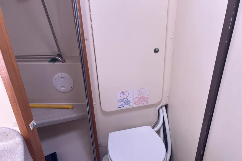 Slide: The Image of 2008 Catalina 350 MkII yacht bathroom with toilet and shower area. - 7