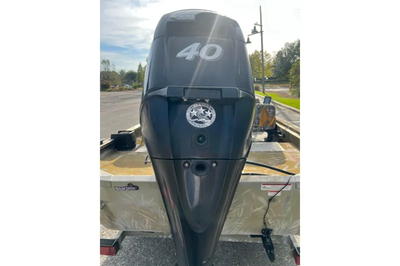 Slide: The Image of 2012 Tracker Grizzly 1754 SC boat with 40 HP outboard motor. - 10