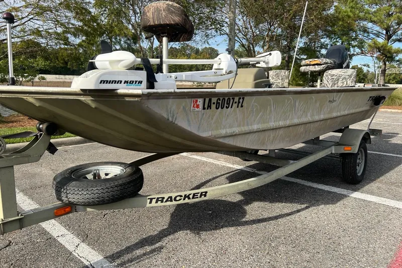 Slide: The Image of 2012 Tracker Grizzly 1754 SC boat on trailer in parking lot. - 3