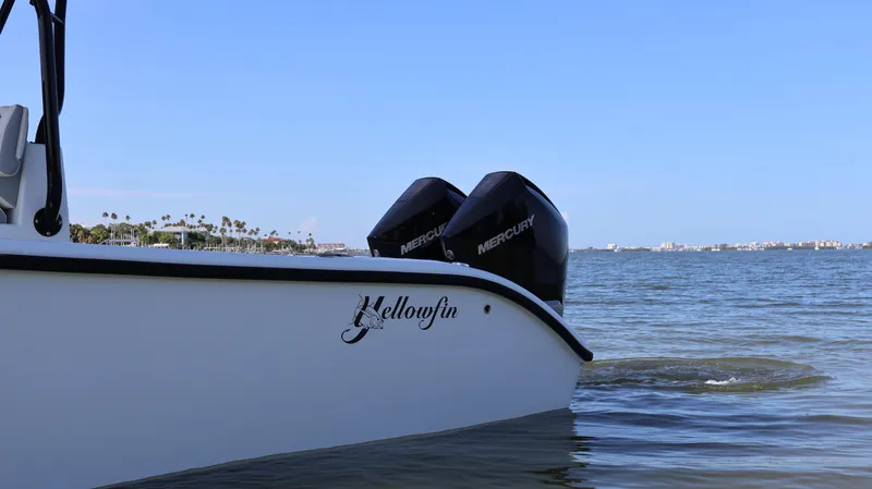Slide: The Image of 2022 Yellowfin 32 Offshore boat with dual Mercury engines on calm water. - 12