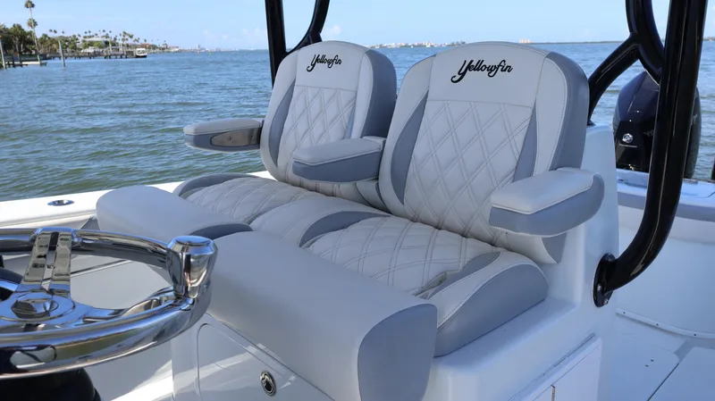 Slide: The Image of 2022 Yellowfin 32 Offshore boat seats with ocean view in background. - 26