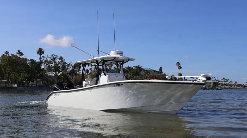 Slide: The Image of 2022 Yellowfin 32 Offshore boat cruising on calm waters. - 3