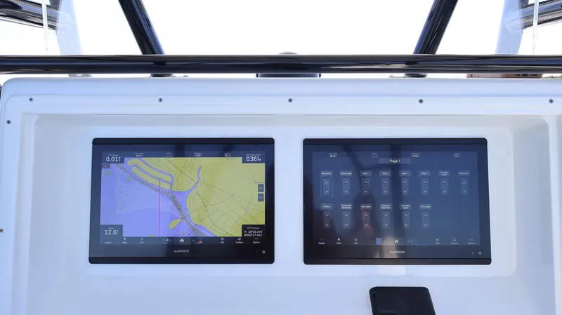 Slide: The Image of 2022 Yellowfin 32 Offshore dashboard with dual navigation screens. - 34