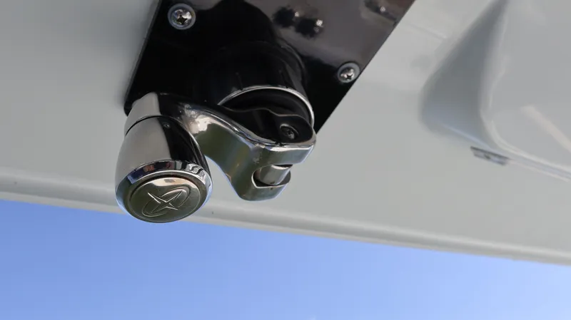 Slide: The Image of Close-up of a 2022 Yellowfin 32 Offshore boat fitting against a clear blue sky. - 37