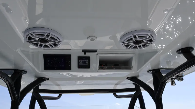 Slide: The Image of 2022 Yellowfin 32 Offshore boat interior with speakers and control panel. - 38