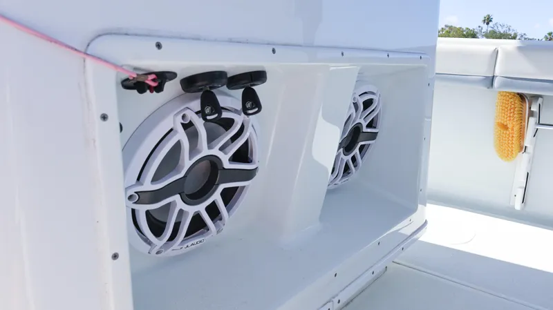 Slide: The Image of 2022 Yellowfin 32 Offshore boat speakers in white compartment. - 39