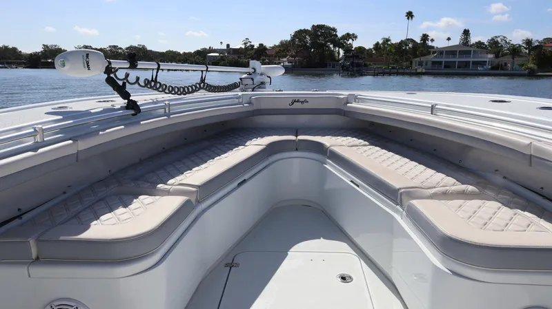 Slide: The Image of 2022 Yellowfin 32 Offshore boat with spacious seating on calm water. - 44