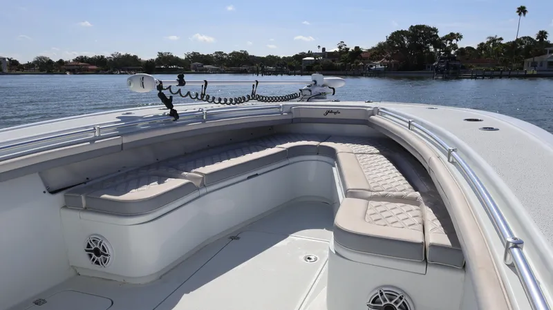 Slide: The Image of 2022 Yellowfin 32 Offshore boat with spacious seating on calm water. - 46