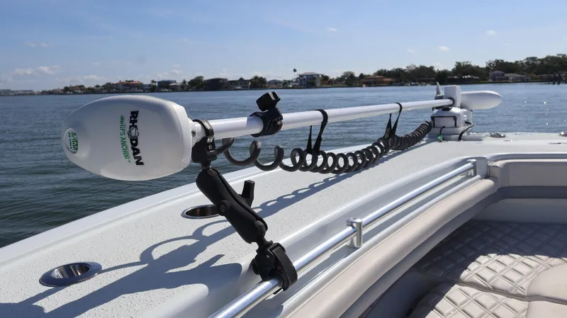 Slide: The Image of 2022 Yellowfin 32 Offshore boat with trolling motor on calm water. - 47