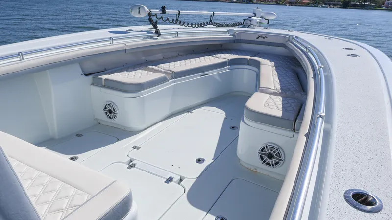 Slide: The Image of 2022 Yellowfin 32 Offshore boat with spacious seating and sleek design on the water. - 48