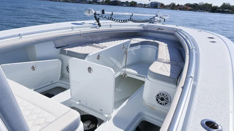 Slide: The Image of 2022 Yellowfin 32 Offshore boat interior with cushioned seating and storage compartments. - 49