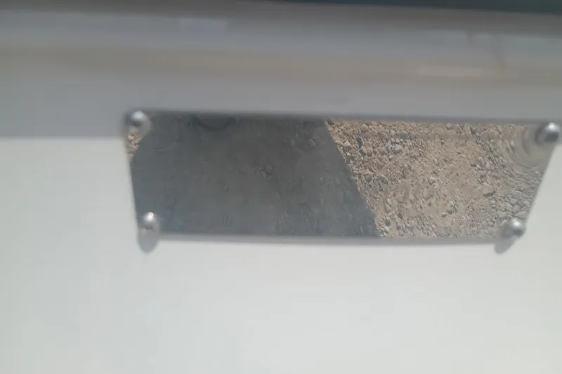 Slide: The Image of Close-up of a metal plate on a 2024 iKon LX21 vehicle. - 14