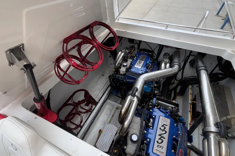 Slide: The Image of 2007 Fountain 38 Lightning engine compartment with dual Mercury 525 EFI engines and red accents. - 13