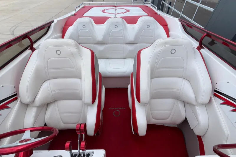 Slide: The Image of 2007 Fountain 38 Lightning boat interior with white and red seating, sleek design. - 20