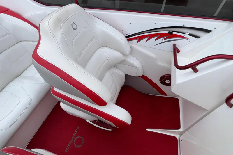 Slide: The Image of 2007 Fountain 38 Lightning boat interior with white and red seating and carpet. - 24