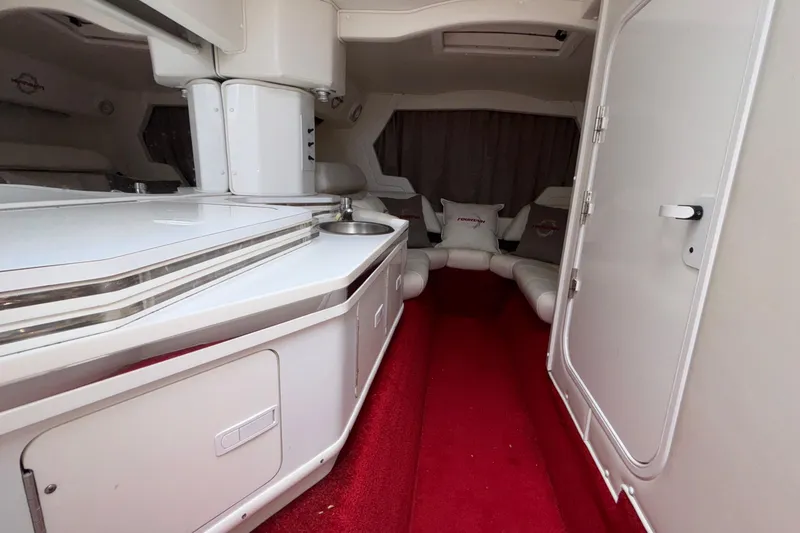 Slide: The Image of Interior of 2007 Fountain 38 Lightning boat with red carpet and white seating. - 29