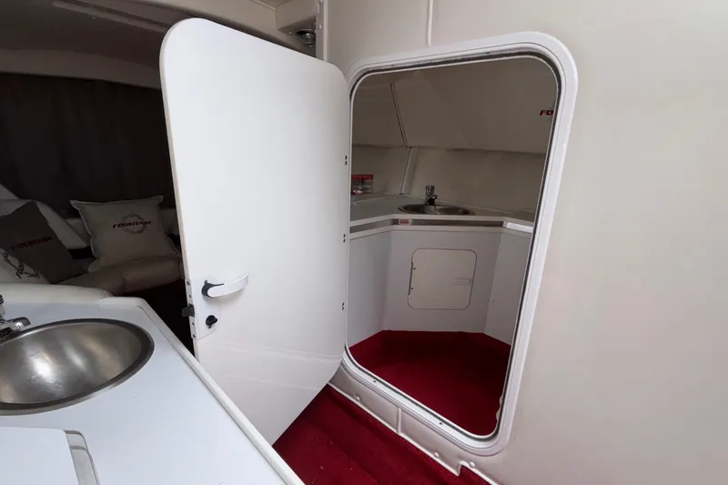 Slide: The Image of Interior of 2007 Fountain 38 Lightning boat with sink and red carpet. - 31