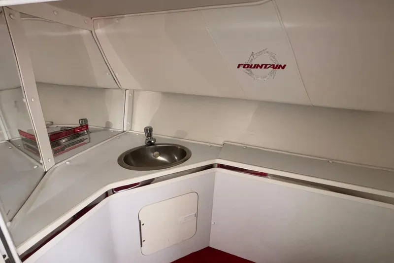 Slide: The Image of 2007 Fountain 38 Lightning boat interior with sink and storage area. - 33