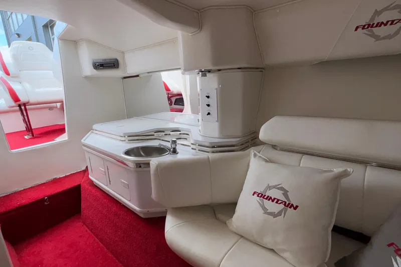 Slide: The Image of Luxurious interior of 2007 Fountain 38 Lightning boat with red carpet and white seating. - 35