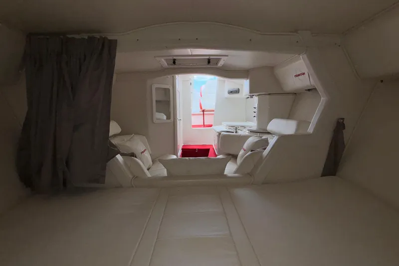 Slide: The Image of Interior of 2007 Fountain 38 Lightning boat, featuring white seating and modern design. - 37