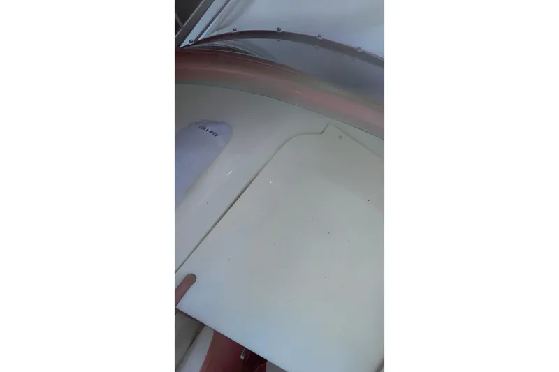 Slide: The Image of 2007 Fountain 38 Lightning boat interior with white flooring and a visible sock. - 45