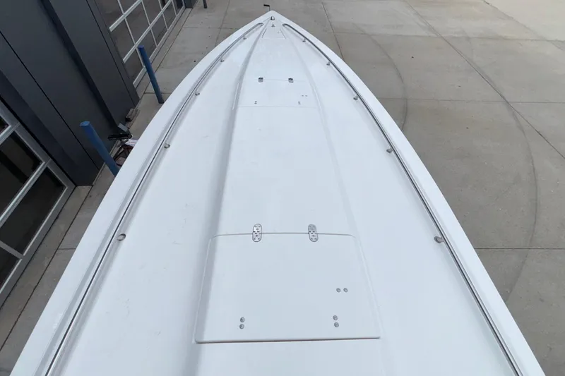 Slide: The Image of 2007 Fountain 38 Lightning boat deck, sleek design, parked on concrete surface. - 46