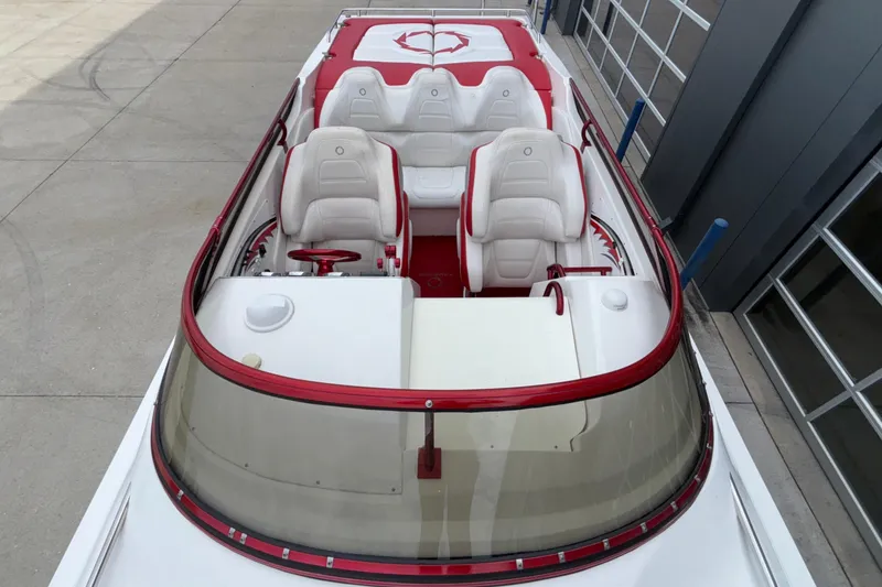 Slide: The Image of 2007 Fountain 38 Lightning boat interior with red and white seating, viewed from above. - 48