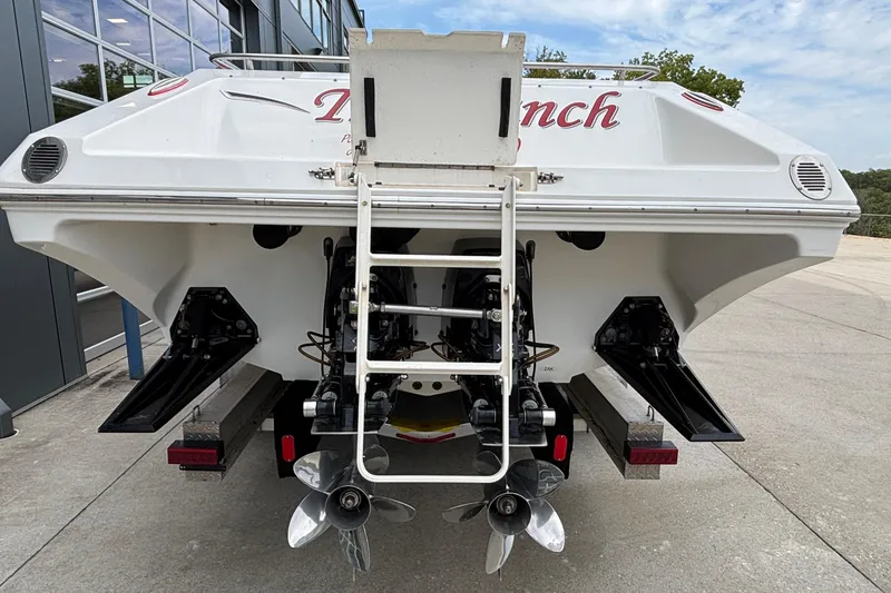 Slide: The Image of 2007 Fountain 38 Lightning boat rear view with dual propellers and ladder. - 49