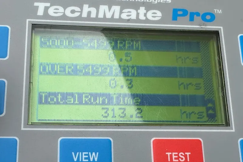 Slide: The Image of Display screen of TechMate Pro showing engine run time data for 2007 Fountain 38 Lightning. - 56