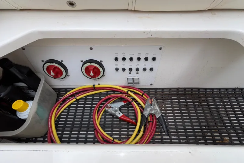 Slide: The Image of 2007 Fountain 38 Lightning boat battery compartment with cables and control panel. - 8