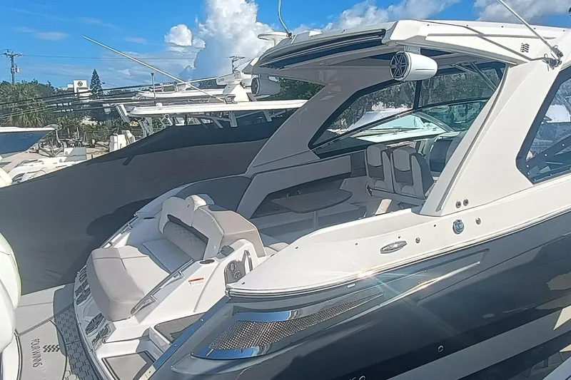Slide: The Image of 2019 Four Winns H350 luxury boat with sleek design and spacious seating. - 3