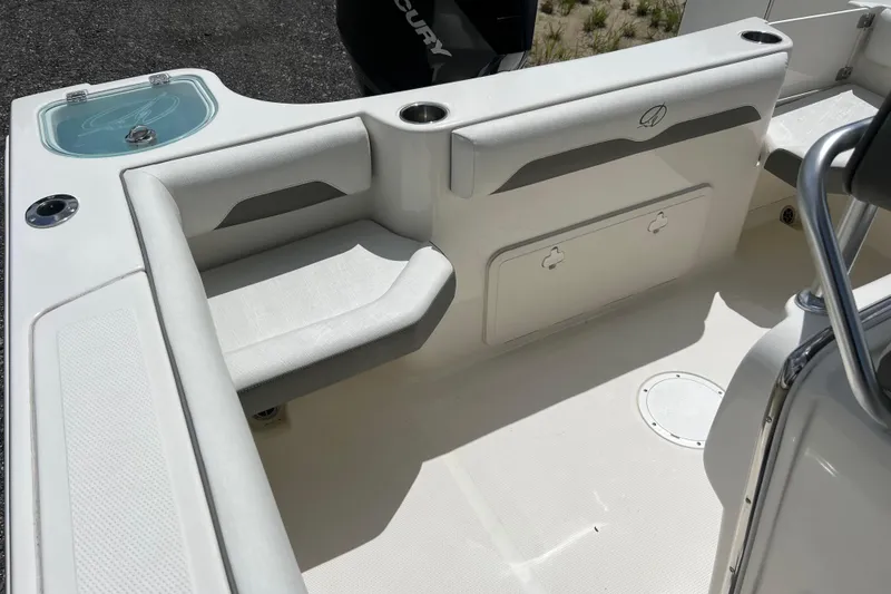 Slide: The Image of 2021 Sailfish 242 CC boat interior with seating and storage compartments. - 16