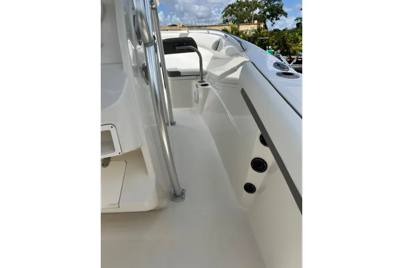 Slide: The Image of 2021 Sailfish 242 CC boat interior with sleek white design and modern features. - 19
