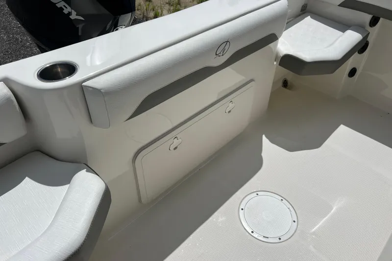 Slide: The Image of 2021 Sailfish 242 CC boat interior with seating and storage compartment. - 24