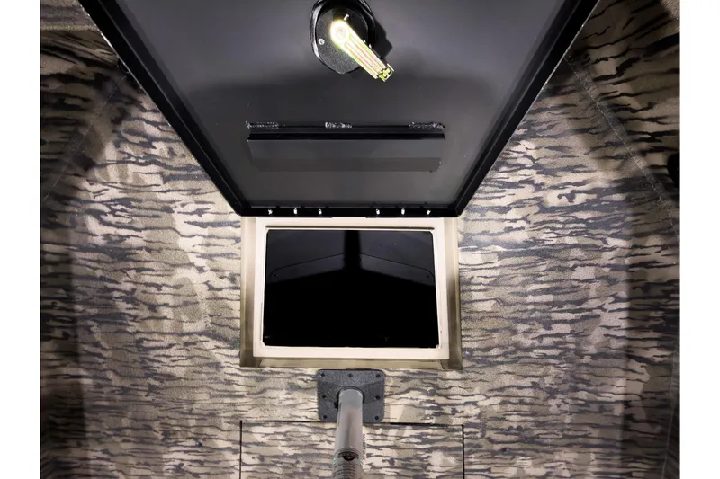 Slide: The Image of Interior view of 2026 Excel 220 Bay Pro Elite boat hatch with camo design. - 19