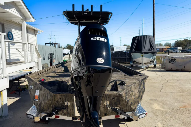 Slide: The Image of Interior view of Excel 220 Bay Pro Elite 2026 at a boat show. - 4