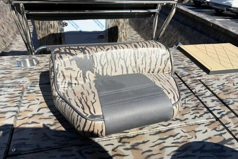 Slide: The Image of 2026 Xpress H210B Bay boat seat with camouflage pattern and cup holder. - 12