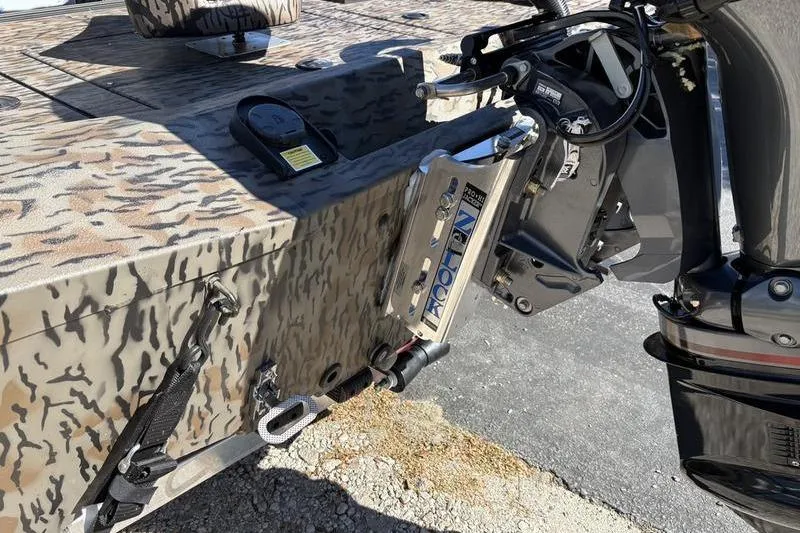 Slide: The Image of 2026 Xpress H210B Bay boat with camo pattern and motor detail. - 13