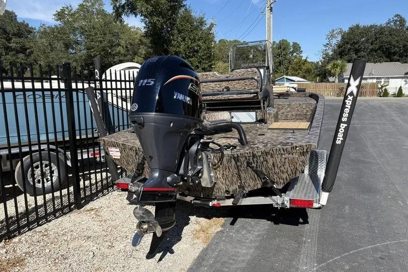 Slide: The Image of 2026 Xpress H210B Bay boat with Yamaha 115 engine on trailer. - 3