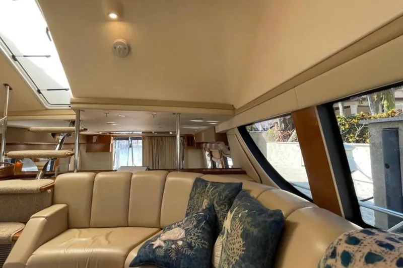 Slide: The Image of Luxurious interior of 2005 Carver 56 Voyager yacht with plush seating and elegant decor. - 12