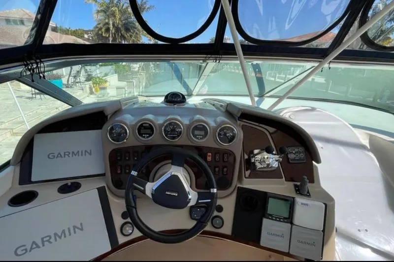 Slide: The Image of 2005 Carver 56 Voyager helm with Garmin navigation system and steering wheel. - 16
