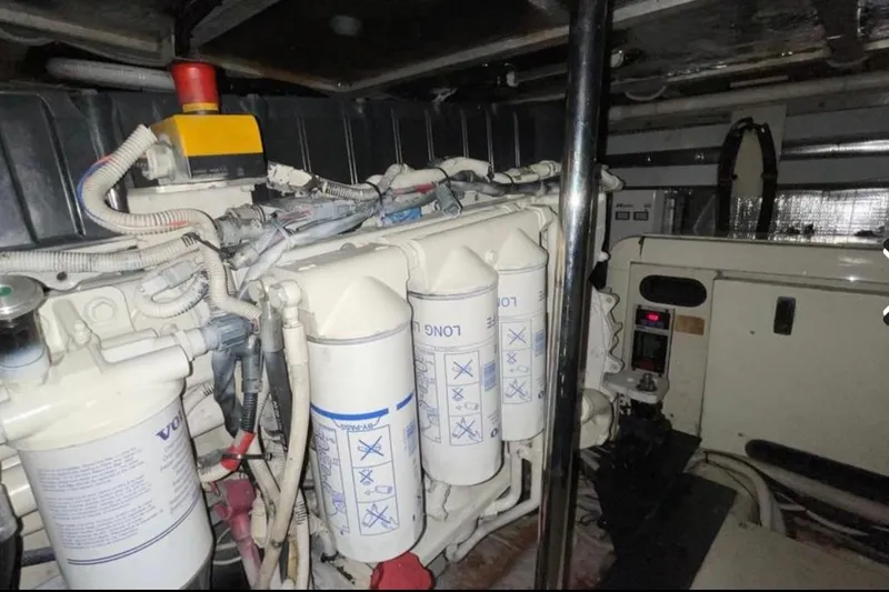 Slide: The Image of Engine room of a 2005 Carver 56 Voyager yacht, featuring Volvo components. - 29