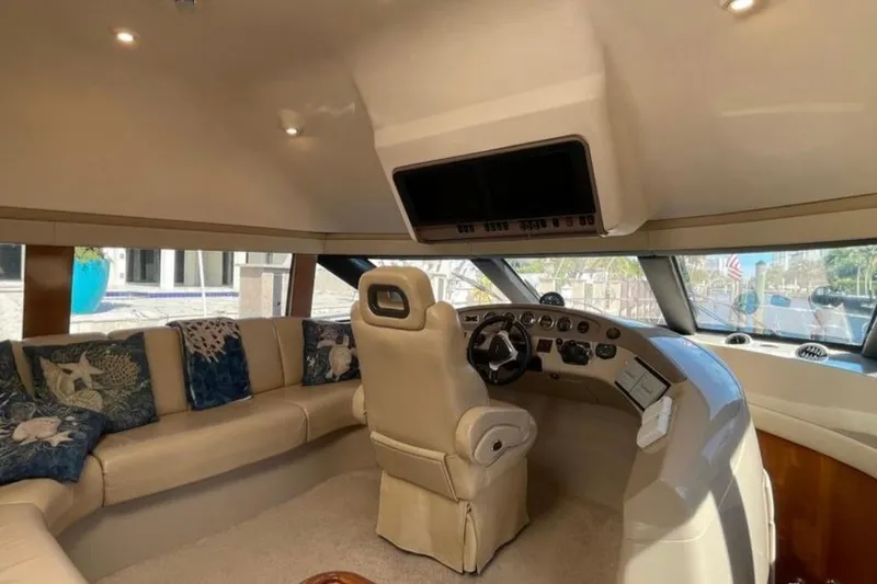 Slide: The Image of Luxurious interior of 2005 Carver 56 Voyager yacht with plush seating and helm. - 8