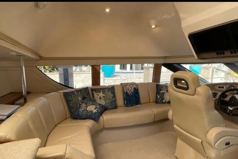 Slide: The Image of Luxurious interior of 2005 Carver 56 Voyager yacht with plush seating and decorative pillows. - 9