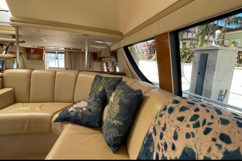 Slide: The Image of Luxurious interior of 2005 Carver 56 Voyager yacht with plush seating and decorative pillows. - 11