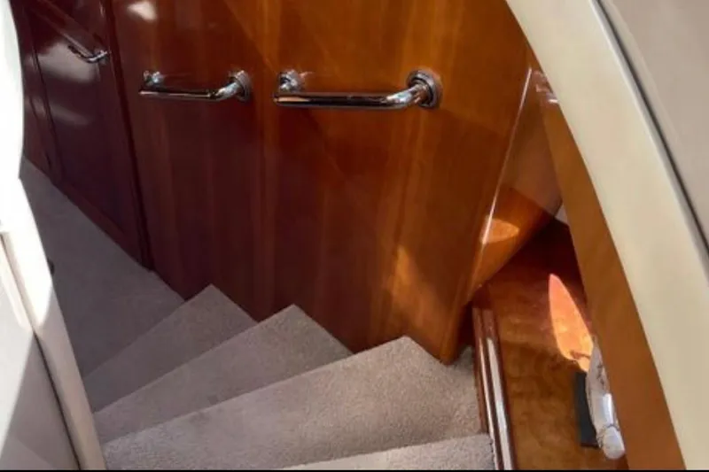 Slide: The Image of Staircase with wooden paneling inside 2005 Carver 56 Voyager yacht. - 17