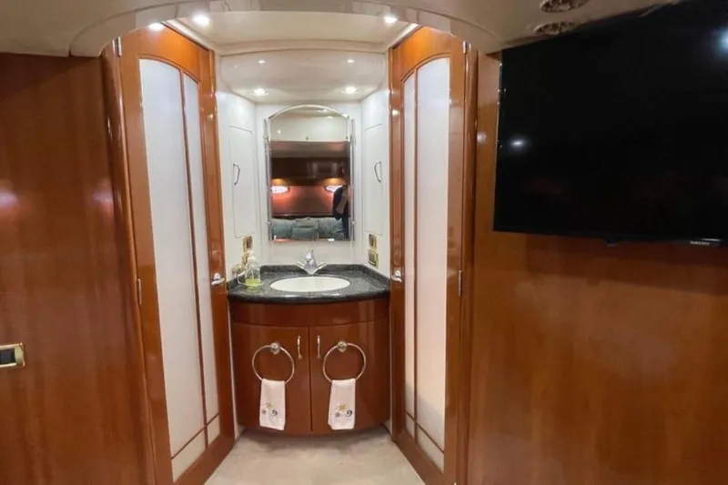 Slide: The Image of Luxurious 2005 Carver 56 Voyager yacht interior with elegant wood finish and modern amenities. - 21