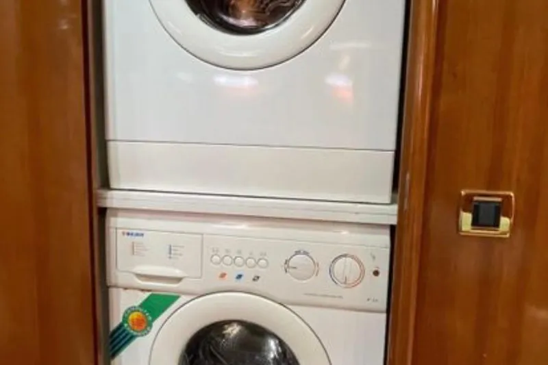 Slide: The Image of Stacked washer and dryer inside 2005 Carver 56 Voyager yacht. - 22