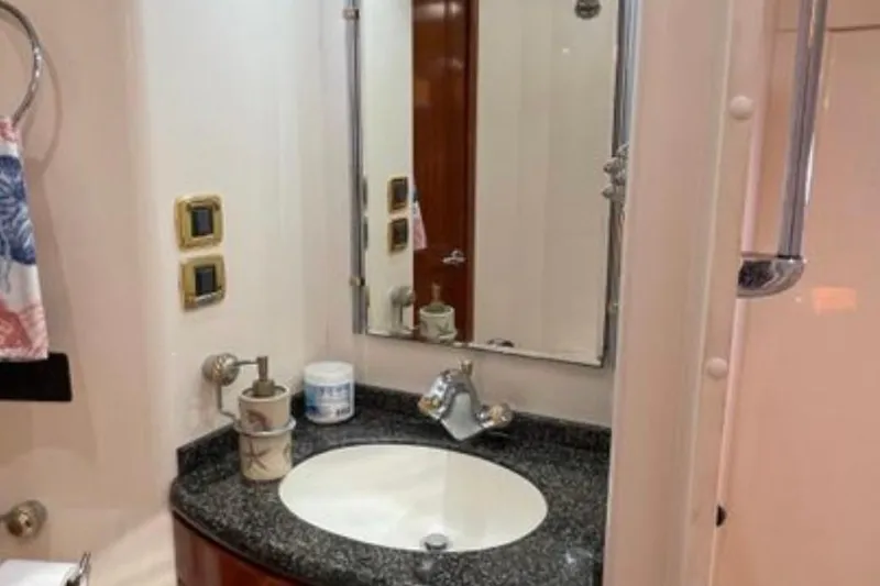 Slide: The Image of Bathroom interior of 2005 Carver 56 Voyager yacht with sink and mirror. - 26